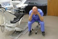 Tired mature dentist with eyes problem