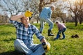 Tired mature man resting in garden