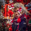 Tired New Year toys seller at the Christmas market in Munich, Germany