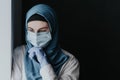 Tired medical worker doctor woman muslim woman in hijab after taking a large number of patients due to epidemic of coronavirus