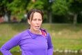 Tired middle-aged woman jogger resting