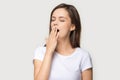 Tired young woman yawning having sleep deprivation Royalty Free Stock Photo