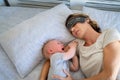 Baby crying while mother sleeping Royalty Free Stock Photo