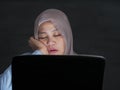 Tired  Muslim Woman Sleeping in Front of Her laptop Royalty Free Stock Photo