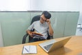 Tired office man feel worried about financial number on report