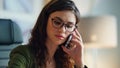 Tired office manager calling telephone at office close up. Sad girl consultant Royalty Free Stock Photo