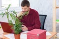 Tired office worker does routine work on the desktop