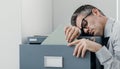 Tired office worker sleeping in the office Royalty Free Stock Photo