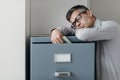 Tired office worker sleeping in the office Royalty Free Stock Photo
