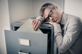 Tired office worker sleeping in the office Royalty Free Stock Photo