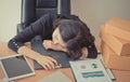 Tired office worker taking a nap on office desk