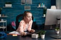 Tired overwork little child browsing school information on computer