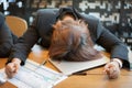 Tired and overworked business woman sleeping on office desk Royalty Free Stock Photo