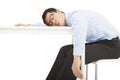 Tired overworked businessman sleeps on desk Royalty Free Stock Photo