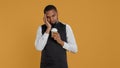 Tired overworked waiter drinking a coffee cup to relax after long shift Royalty Free Stock Photo
