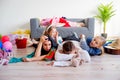 Tired parents and romping kids Royalty Free Stock Photo