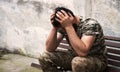 Sad soldier sits on the bench Royalty Free Stock Photo