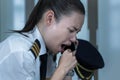Tired pilot yawning at work Royalty Free Stock Photo