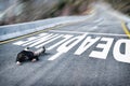 Tired powerless man in black jacket and grey trousers fallen on road overcome deadline title