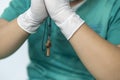 Tired praying doctor at the hospital. A doctor, a nurse who is thinking about treating a disease and a pandemic. Surgeon after Royalty Free Stock Photo