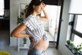 Tired pregnant woman expecting baby and feeling exhausted at home on maternity leave Royalty Free Stock Photo