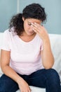 Tired pregnant woman sitting on sofa Royalty Free Stock Photo