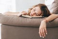 Tired relaxed woman sleep with book on sofa Royalty Free Stock Photo