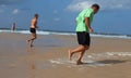 Tired running men on the beach in the morning.