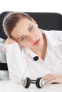 Tired, sad business woman at call center. Royalty Free Stock Photo