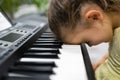 Tired Sad Frustrated Unhappy Child Girl Playing Piano Keyboard