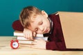 Tired school boy asleep on books. little student sleeping on tex Royalty Free Stock Photo