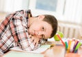 Tired schoolboy in classroom Royalty Free Stock Photo