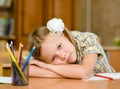 Tired schoolgirl in classroom Royalty Free Stock Photo