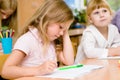 Tired schoolgirl in classroom Royalty Free Stock Photo