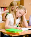 Tired schoolgirl in classroom