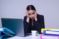 Tired secretary. Overworked Business woman. Busy working. Feeling tired and stressed. Frustrated young woman sitting at Royalty Free Stock Photo