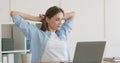 Tired of sedentary work woman stretching body at workplace