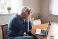 Tired senior man suffering from headache massaging eyes Royalty Free Stock Photo