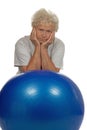 Tired senior woman with a fitball Royalty Free Stock Photo