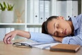 Tired, sleep and woman in business on her table feeling burnout and overworked while sleeping in her office. Nap Royalty Free Stock Photo