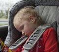 Tired sleeping child in car