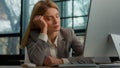 Tired sleeping lazy napping businesswoman boring with work in office with computer overworked exhausted sick ill woman Royalty Free Stock Photo