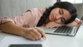 Tired sleeping woman sleep closed eyes on office table sleepy overworked female student girl exhausted weary lazy Indian Royalty Free Stock Photo