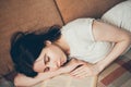 Tired sleeping young woman with a book Royalty Free Stock Photo
