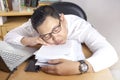 Tired Sleepy Asian Businessman Having Overworked Royalty Free Stock Photo