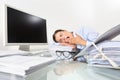 Tired sleepy business woman yawning, working at office desk in f Royalty Free Stock Photo