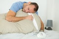 Tired sleepy man in bed Royalty Free Stock Photo