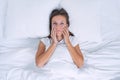 Tired sleepy woman with chronic fatigue or depression lying in the bed. Bad morning Royalty Free Stock Photo