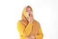 Tired sleepy woman yawning wearing hijab