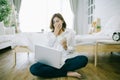 Tired sleepy woman yawning, working at home and holding a cup of coffee, Royalty Free Stock Photo